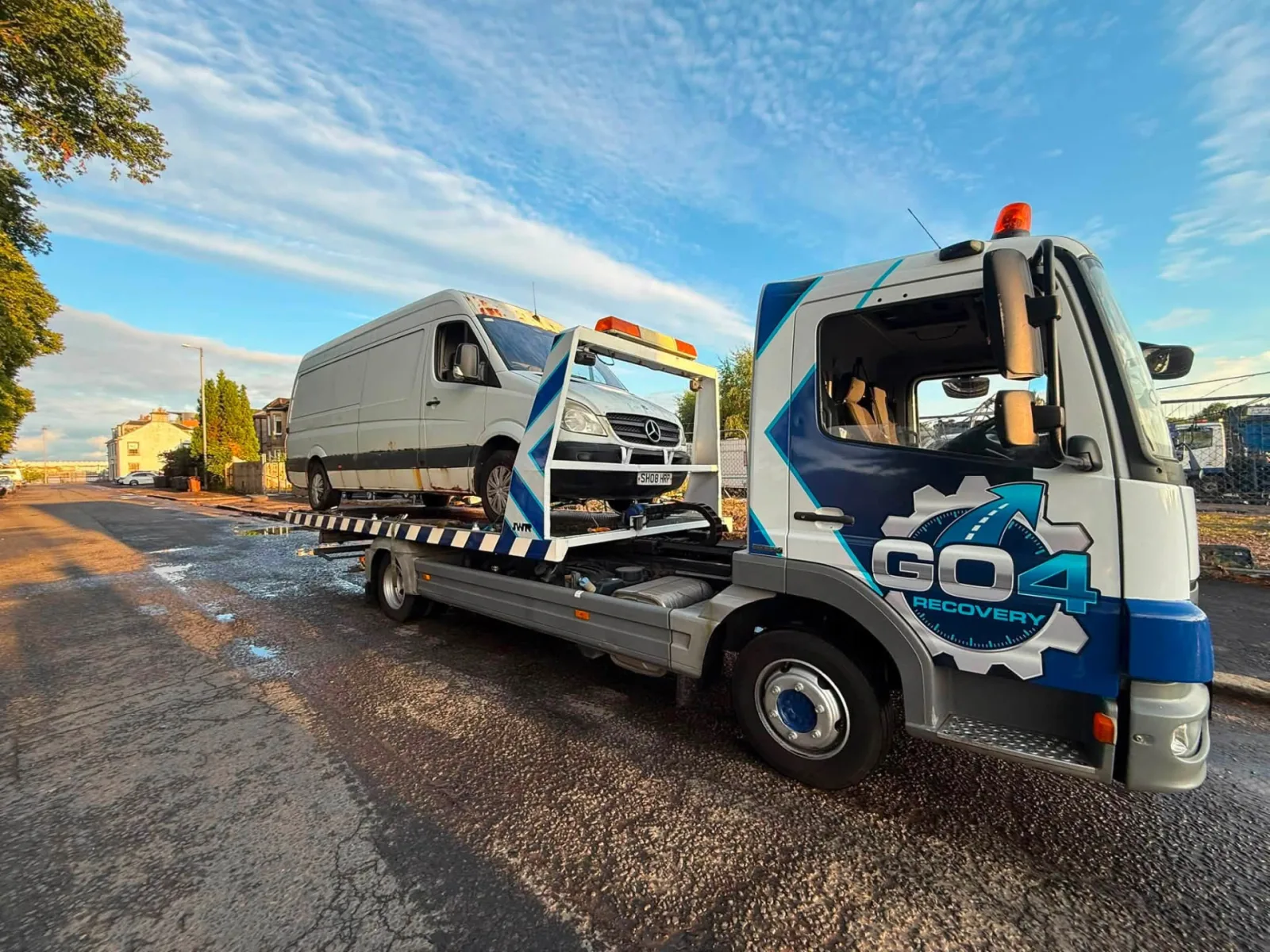 GO4 Recovery flatbed transporter carrying a commercial van in Renfrewshire